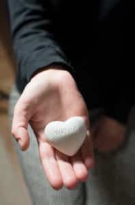 Canva Person Holding in Hand a Heart scaled
