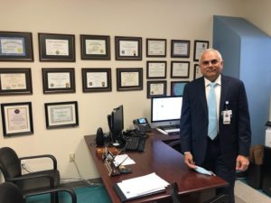 Dr Asim Shah board chair in his office resized 600p